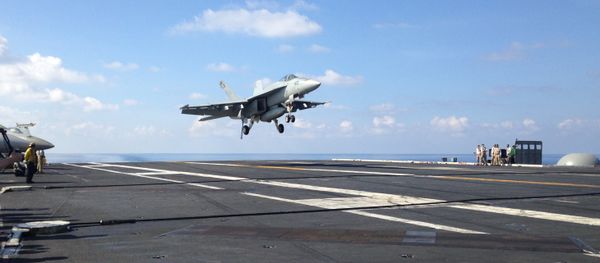 F-18 jet fighter takes off on the USS John C. Stennis, aircraft carrier in the South China Sea on Friday, April 15, 2016. U.S. Defense Secretary Ash Carter visited the aircraft carrier during a trip to the region - Sputnik International