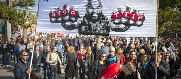 People rally against the Transatlantic Trade and Investment Partnership (TTIP), a massive free-trade accord being negotiated by the European Union and the United States, on October 10, 2015 in Amsterdam. People rally against the Transatlantic Trade and Investment Partnership (TTIP), a massive free-trade accord being negotiated by the European Union and the United States, on October 10, 2015 in Amsterdam. - Sputnik International