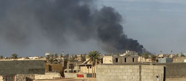 In this Monday, Jan. 4, 2016 photo, smoke rises from Islamic State positions following a U.S.-led coalition airstrike in Ramadi, 70 miles (115 kilometers) west of Baghdad, Iraq In this Monday, Jan. 4, 2016 photo, smoke rises from Islamic State positions following a U.S.-led coalition airstrike in Ramadi, 70 miles (115 kilometers) west of Baghdad, Iraq - Sputnik International