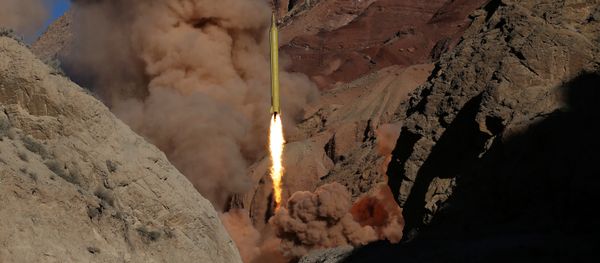 A Qadr H long-range ballistic surface-to-surface missile is fired by Iran's powerful Revolutionary Guard during a maneuver. file photo A Qadr H long-range ballistic surface-to-surface missile is fired by Iran's powerful Revolutionary Guard during a maneuver. file photo - Sputnik International