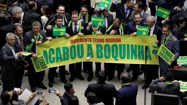 Lower house members who support the impeachment demonstrate during a session to review the request for Brazilian President Dilma Rousseff's impeachment, at the Chamber of Deputies in Brasilia, Brazil April 15, 2016 Lower house members who support the impeachment demonstrate during a session to review the request for Brazilian President Dilma Rousseff's impeachment, at the Chamber of Deputies in Brasilia, Brazil April 15, 2016 - Sputnik International