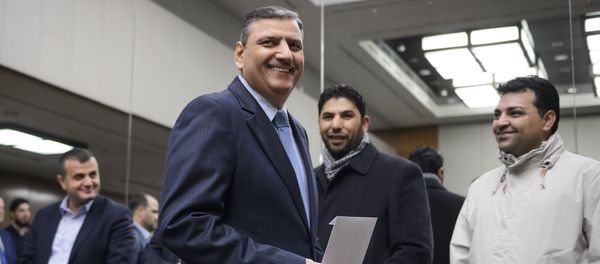 Syrian opposition chief Riad Hijab (C) arrives to a press conference after Syrian peace talks  in Geneva (File) - Sputnik International