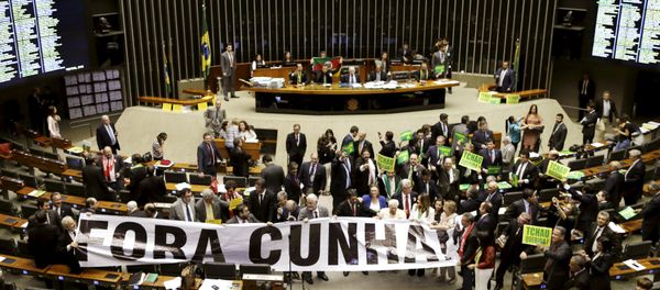Congressmen demonstrate against President of the Chamber of Deputies Cunha during a session to review the request for Brazilian President Dilma Rousseff's impeachment, at the Chamber of Deputies in Brasilia, Brazil April 16, 2016 Congressmen demonstrate against President of the Chamber of Deputies Cunha during a session to review the request for Brazilian President Dilma Rousseff's impeachment, at the Chamber of Deputies in Brasilia, Brazil April 16, 2016 - Sputnik International