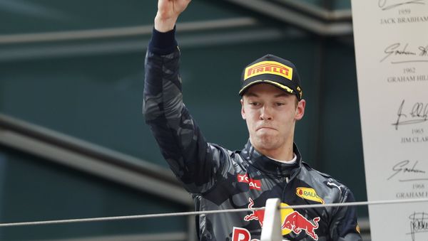 Formula One - Chinese F1 Grand Prix - Shanghai, China - 17/4/16 - Red Bull Formula One driver Daniil Kvyat of Russia celebrates after the Chinese Grand Prix - Sputnik International