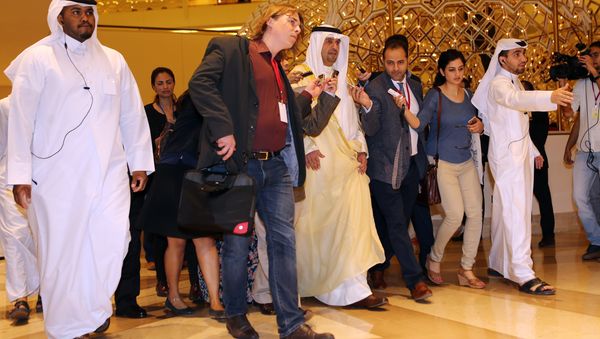 Kuwaiti Minister of Finance and Minister of Oil Anas al-Saleh (C) arrives for the organization of Petroleum Exporting Countries (OPEC) meeting, in the Qatari capital Doha, on April 17, 2016 - Sputnik International