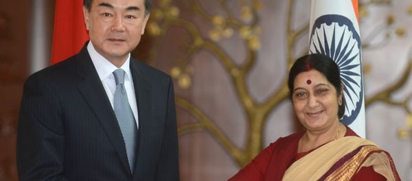 Chinese Foreign Minister Wang Yi (left) and Indian Foreign Minister Sushma Swaraj.(File) - Sputnik International