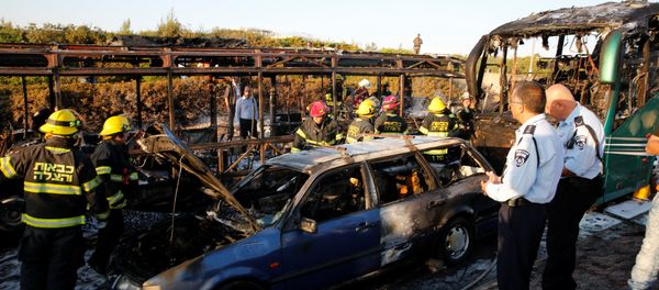 Emergency workers search the scene after a blast on a bus in Jerusalem - Sputnik International