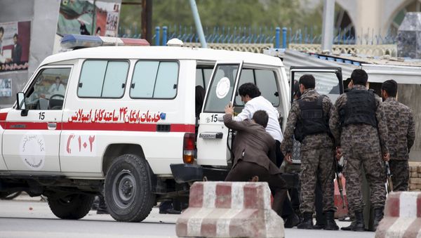 Afghan security forces transfer injured security personnel into an ambulance after a suicide car bomb attack in Kabul, Afghanistan April 19, 2016. Afghan security forces transfer injured security personnel into an ambulance after a suicide car bomb attack in Kabul, Afghanistan April 19, 2016. - Sputnik International