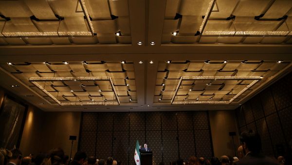 Riad Hijab, chief coordinator High Negotiations Committee (HNC) addresses a news conference aside of Syria peace talks in Geneva, Switzerland, April 19, 2016. - Sputnik International