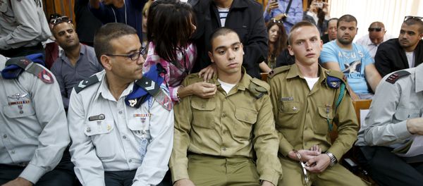 The father (C, back) of Israeli soldier Elor Azaria (C, seated), who is charged with manslaughter by the Israeli military The father (C, back) of Israeli soldier Elor Azaria (C, seated), who is charged with manslaughter by the Israeli military - Sputnik International
