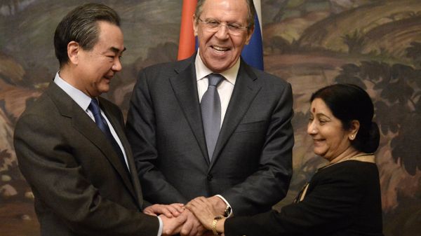 From left: Chinese Foreign Minister Wang Yi, Russian Foreign Minister Sergei Lavrov and Indian Foreign Minister Sushma Swaraj during are photographed before a plenary meeting of the foreign ministers of Russia, India and China (RIC) in the Reception House of the Russian Foreign Ministry. From left: Chinese Foreign Minister Wang Yi, Russian Foreign Minister Sergei Lavrov and Indian Foreign Minister Sushma Swaraj during are photographed before a plenary meeting of the foreign ministers of Russia, India and China (RIC) in the Reception House of the Russian Foreign Ministry. - Sputnik International