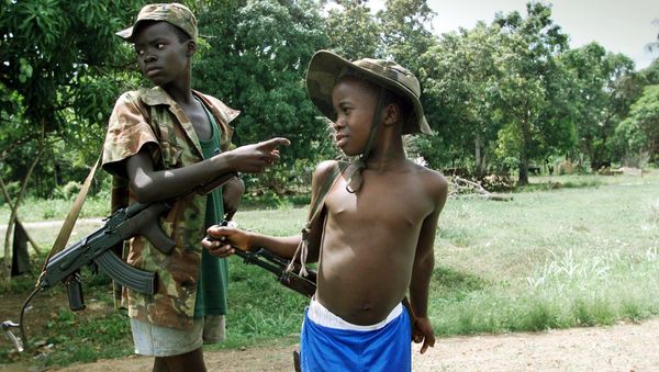 Two children enrolled with Sierra Leonean troops fighting rebels of the Revolutionary United Front (RUF). Two children enrolled with Sierra Leonean troops fighting rebels of the Revolutionary United Front (RUF). - Sputnik International