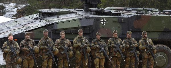 Mountain infantry soldiers stand in front of a troops transporter Boxer after an exercise of the mountain infantry brigade 23 of the German Bundeswehr near the Bavarian village Bad Reichenhall, southern Germany, on March 23, 2016 - Sputnik International