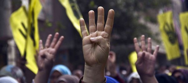 Pro-Brotherhood protesters raise their hands with the Rabia gesture during a march Pro-Brotherhood protesters raise their hands with the Rabia gesture during a march - Sputnik International