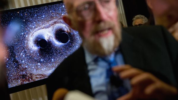 visual of gravitational waves from two converging black holes is depicted on a monitor behind Laser Interferometer Gravitational-Wave Observatory (LIGO) Co-Founder Kip Thorne as he speaks to members of the media following a news conference at the National Press Club in Washington, Thursday, Feb. 11, 2016 visual of gravitational waves from two converging black holes is depicted on a monitor behind Laser Interferometer Gravitational-Wave Observatory (LIGO) Co-Founder Kip Thorne as he speaks to members of the media following a news conference at the National Press Club in Washington, Thursday, Feb. 11, 2016 - Sputnik International
