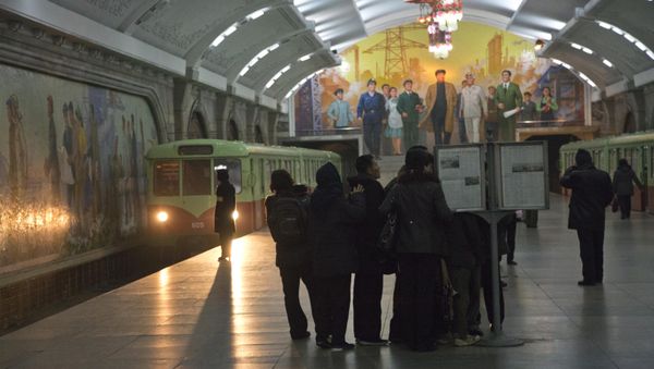 North Korean subway commuters gather around a public newspaper stand on the train platform in Pyongyang (File) North Korean subway commuters gather around a public newspaper stand on the train platform in Pyongyang (File) - Sputnik International