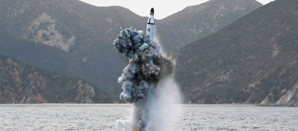 North Korean leader Kim Jong Un guides on the spot the underwater test-fire of strategic submarine ballistic missile in this undated photo released by North Korea's Korean Central News Agency (KCNA) in Pyongyang on April 24, 2016 - Sputnik International