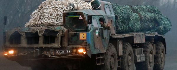 A Ukrainian soldier waves as troops with Smerch multiple launch rocket systems drive on a road not far from the eastern Ukrainian city of Kramatorsk in the Donetsk region on March 6, 2015 A Ukrainian soldier waves as troops with Smerch multiple launch rocket systems drive on a road not far from the eastern Ukrainian city of Kramatorsk in the Donetsk region on March 6, 2015 - Sputnik International