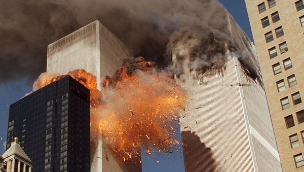 Smoke billows from one of the towers of the World Trade Center and flames and debris explode from the second tower, Tuesday, Sept. 11, 2001 Smoke billows from one of the towers of the World Trade Center and flames and debris explode from the second tower, Tuesday, Sept. 11, 2001 - Sputnik International