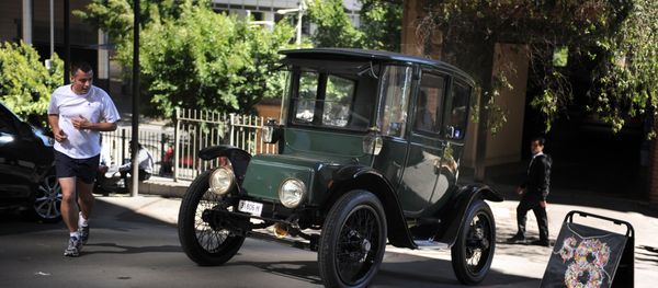 In this photograph taken on September 5, 2012, Bill Lloyd, 61, (obscured) a retired Australian mechanical engineer, patent attorney and vintage car collector sits in his 1915 Detroit electric car out of the garage in Sydney - Sputnik International