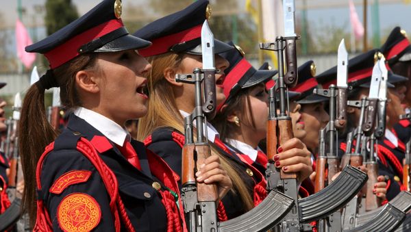 Female Kurdish Peshmerga take part their graduation ceremony at a police academy in Zakho district of the Dohuk Governorate of the Iraqi Kurdistan province, Iraq March 30, 2016 - Sputnik International