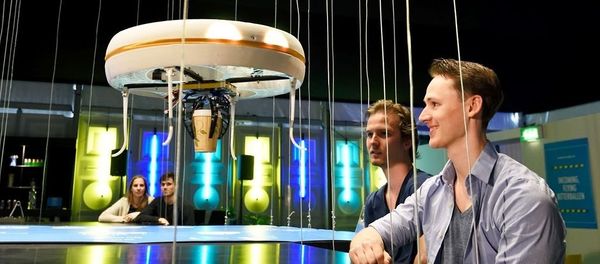 This handout picture released on Tuesday, April 19 by the Eindhoven University of Technology shows a flying drone bringing drinks to customers in the world's first drone cafe in Eindhoven, The Netherlands - Sputnik International