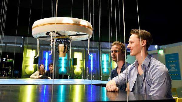 This handout picture released on Tuesday, April 19 by the Eindhoven University of Technology shows a flying drone bringing drinks to customers in the world's first drone cafe in Eindhoven, The Netherlands This handout picture released on Tuesday, April 19 by the Eindhoven University of Technology shows a flying drone bringing drinks to customers in the world's first drone cafe in Eindhoven, The Netherlands - Sputnik International