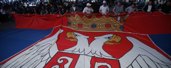 Serbian Progressive Party supporters hold Serbian flag during a pre-election rally in Belgrade, Serbia, Thursday, April 21, 2016 - Sputnik International
