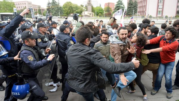 Riot police use tear gas to disperse demonstrators during a protest against parliament speaker Ismail Kahraman, outside the Turkish parliament in Ankara, Turkey April 26, 2016. - Sputnik International