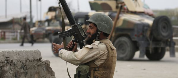 An Afghan National Army (ANA) soldier takes up position at the site of a suicide car bomb attack in Kabul, Afghanistan. (File) - Sputnik International