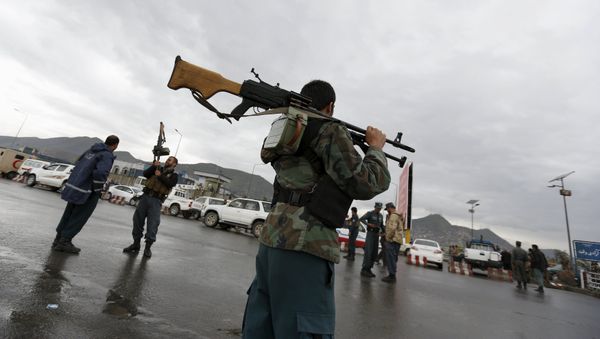 Afghan policemen stand guard at the site of a suicide car bomb attack on a government security building in Kabul, Afghanistan Afghan policemen stand guard at the site of a suicide car bomb attack on a government security building in Kabul, Afghanistan - Sputnik International