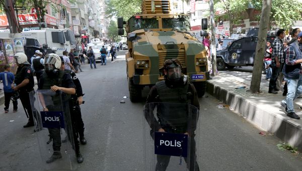 A Turkish military vehicle is surrounded by security forces after it hit and killed a local woman in an accident in the Kurdish-dominated southeastern city of Diyarbakir, Turkey April 27, 2016. A Turkish military vehicle is surrounded by security forces after it hit and killed a local woman in an accident in the Kurdish-dominated southeastern city of Diyarbakir, Turkey April 27, 2016. - Sputnik International