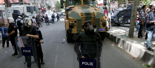 A Turkish military vehicle is surrounded by security forces after it hit and killed a local woman in an accident in the Kurdish-dominated southeastern city of Diyarbakir, Turkey April 27, 2016. - Sputnik International