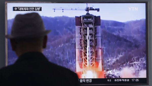 A man watches a TV news program showing a file footage of North Korea's rocket launch at Seoul Railway Station in Seoul, South Korea, Thursday, April 28, 2016. A man watches a TV news program showing a file footage of North Korea's rocket launch at Seoul Railway Station in Seoul, South Korea, Thursday, April 28, 2016. - Sputnik International