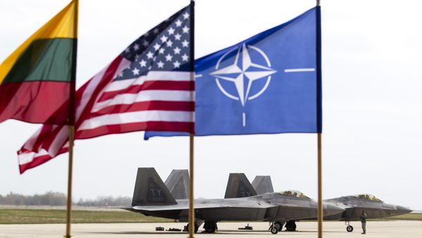 US Air Force F-22 Raptor fighter jets stand on the tarmac after landing at the Siauliai airbase, some 230 km (144 miles) east of the capital Vilnius, Lithuania, Wednesday, April 27, 2016. - Sputnik International