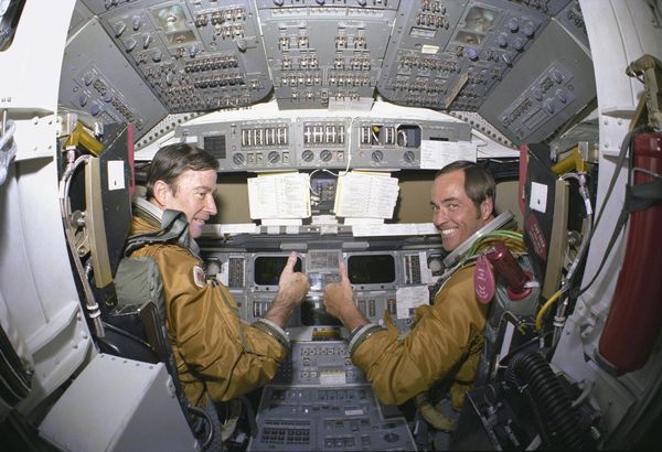 Prime crew astronauts for the first space shuttle mission, Commander John Young and Pilot Robert Crippen, take a break from their intensive training schedule to pose for pictures in the flight deck of the orbiter Columbia. The first Columbia orbiter launched on 12 April 1981 and returned on 14 April, 54.5 hours later, having orbited the Earth 37 times Prime crew astronauts for the first space shuttle mission, Commander John Young and Pilot Robert Crippen, take a break from their intensive training schedule to pose for pictures in the flight deck of the orbiter Columbia. The first Columbia orbiter launched on 12 April 1981 and returned on 14 April, 54.5 hours later, having orbited the Earth 37 times - Sputnik International