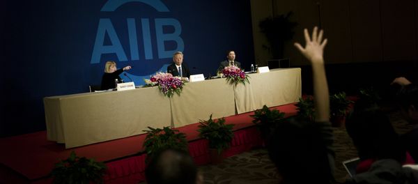 Jin Liqun (C), the first president of the Asian Infrastructure Investment Bank (AIIB), speaks to journalists during a press conference in Beijing on January 17, 2016 Jin Liqun (C), the first president of the Asian Infrastructure Investment Bank (AIIB), speaks to journalists during a press conference in Beijing on January 17, 2016 - Sputnik International
