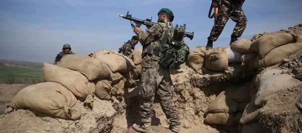 An Afghan National Army soldier, center, takes his position, following weeks of heavy clashes to recapture the area from Taliban militants in Dand-e Ghouri district in Baghlan province, north of Kabul, Afghanistan (File) - Sputnik International