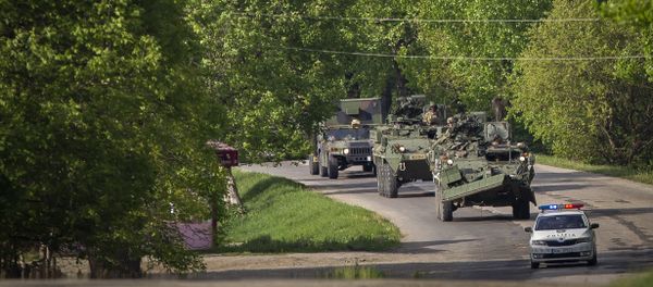 US military vehicles drive on a road in Sculeni, Moldova, Tuesday, May 3, 2016 - Sputnik International