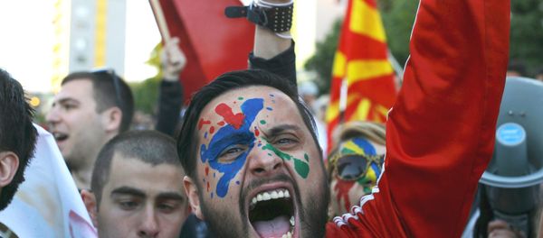 A demonstrator is seen with his face painted in support of a colorful revolution during a protest against the government, in front of the EU office in Skopje, Macedonia April 21, 2016. - Sputnik International