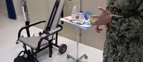 This photo reviewed by the US military and made during an escorted visit shows a US naval medic explaining the feeding chair procedures at the detention facility in Guantanamo Bay, Cuba, April 9, 2014. This photo reviewed by the US military and made during an escorted visit shows a US naval medic explaining the feeding chair procedures at the detention facility in Guantanamo Bay, Cuba, April 9, 2014. - Sputnik International