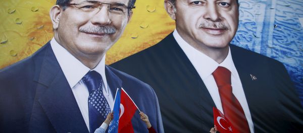 A banner showing Turkish President Tayyip Erdogan and Prime Minister Ahmet Davutoglu (L) together during an election rally in the central Anatolian city of Konya, Turkey, October 30, 2015. A banner showing Turkish President Tayyip Erdogan and Prime Minister Ahmet Davutoglu (L) together during an election rally in the central Anatolian city of Konya, Turkey, October 30, 2015. - Sputnik International