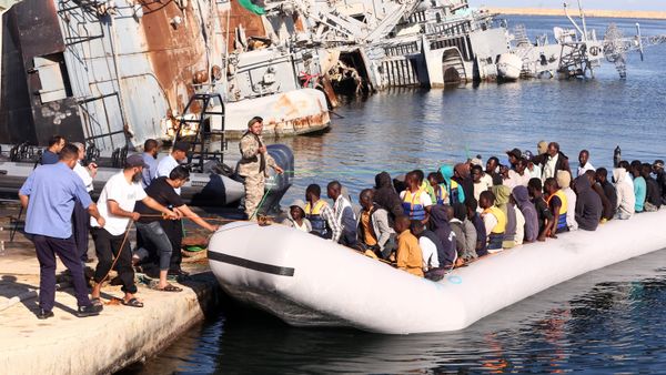 The Libyan coastguard pull a boat carrying illegal African migrants, rescued as they were trying to reach Europe, at a naval base near the capital Tripoli on September 29, 2015. - Sputnik International