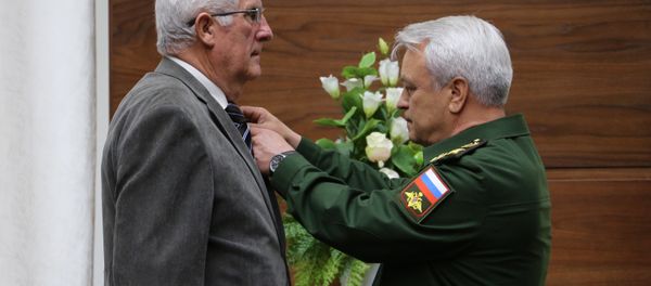 Jean-Claude Mague, left, a French citizen, during the presentation of his family military awards - the National Order of the Legion of Honor and the Military Cross - to the parents of Hero of Russia Alexander Prokhorenko, who was killed in Syria. The ceremony took place at the Russian Defense Ministry. - Sputnik International