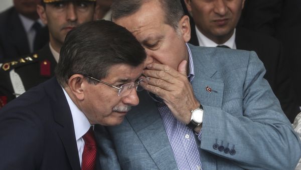 Turkey President Recep Tayyip Erdogan (R) speaks with Turkish prime minister Ahmet Davutoglu (L) (file) - Sputnik International