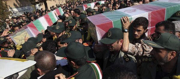 Civilians and armed forces members carry the flag draped coffins of Iranian Revolutionary Guard's Gen. Mohsen Ghajarian, right, and some of his comrades who were killed in fighting in Syria, during their funeral ceremony outside the headquarters of the guard's ground forces in Tehran, Iran, Saturday, Feb. 6, 2016. Civilians and armed forces members carry the flag draped coffins of Iranian Revolutionary Guard's Gen. Mohsen Ghajarian, right, and some of his comrades who were killed in fighting in Syria, during their funeral ceremony outside the headquarters of the guard's ground forces in Tehran, Iran, Saturday, Feb. 6, 2016. - Sputnik International