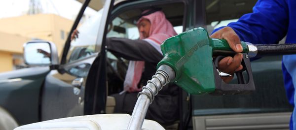 An employee fills a container with diesel at a gas station in Riyadh. An employee fills a container with diesel at a gas station in Riyadh. - Sputnik International