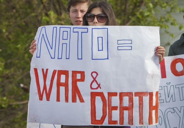 Moldovan youngsters hold anti-NATO banners during a protest in the border town of Sculeni, Moldova, Tuesday, May 3, 2016 against the May 3-20 joint US-Moldovan military exercises as less than 20 percent of Moldovans want to join the military alliance Moldovan youngsters hold anti-NATO banners during a protest in the border town of Sculeni, Moldova, Tuesday, May 3, 2016 against the May 3-20 joint US-Moldovan military exercises as less than 20 percent of Moldovans want to join the military alliance - Sputnik International