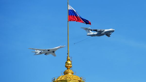The Tu-160 bomber is seen flying during the Victory Day Parade in Moscow on May 9, 2016 - Sputnik International