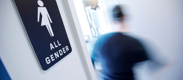 A bathroom sign welcomes both genders at the Cacao Cinnamon coffee shop in Durham, North Carolina May 3, 2016 - Sputnik International